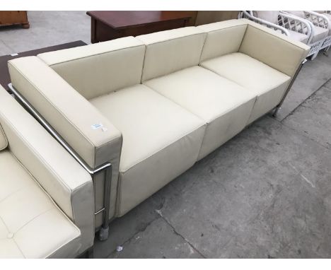 A MODERN CREAM LEATHER THREE SEATER SOFA ON TUBULAR CHROME SUPPORTS 210 CM X 78 CM X 67 CM HIGH 