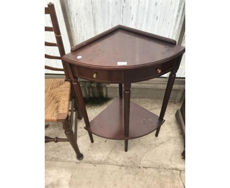 A MAHOGANY CORNER TABLE WITH TWO DRAWERS AND LOWER SHELF 