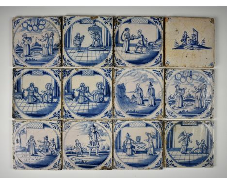 A set of eleven Dutch Delft blue and white tiles, probably 17th century, the tiles with central fields with roundels depictin