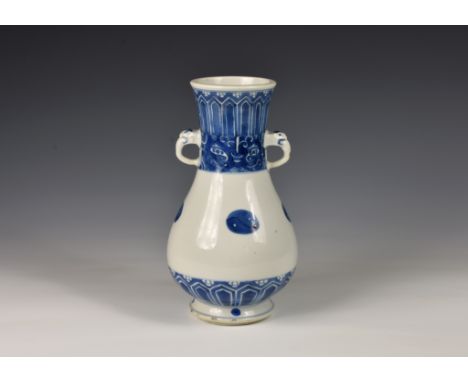 A Chinese porcelain twin handled baluster vase, Kangxi period (1662-1722), the stoutly potted vase with slightly waisted neck