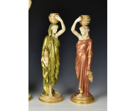 A pair of Royal Worcester porcelain figures of water carriers, modelled by James Hadley, the classical maidens in green and c