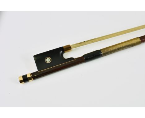 A fine violin bow stamped E. Sartory a Paris, gold mounted back and front ring, headplate, ferrule and Parisian ring surround