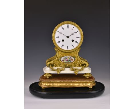 A good 19th century French ormolu, porcelain and white marble drum clock, the white 5in. dial with black Roman numerals, fron