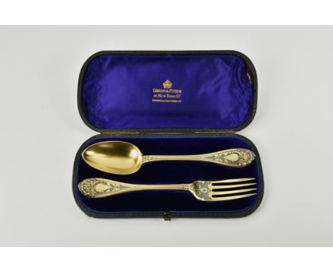 A Victorian silver gilt christening fork & spoon set, Chawner & Co., London 1866, with blackened chased floral and foliate de