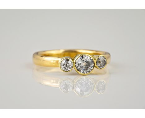 A handmade 18ct yellow gold and diamond three stone ring, the three old brilliant cut diamonds with cut culets, total 0.80ct,