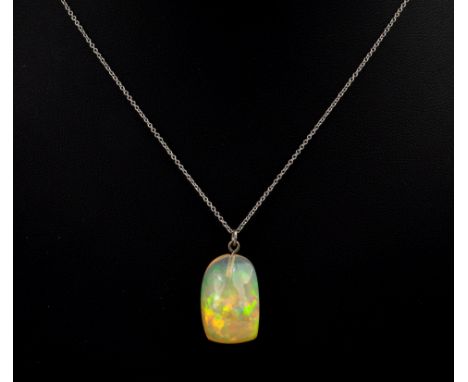 An 18ct white gold and opal pebble pendant, the 16.82ct harlequin jelly opal on an 18ct white gold cable link trace chain.