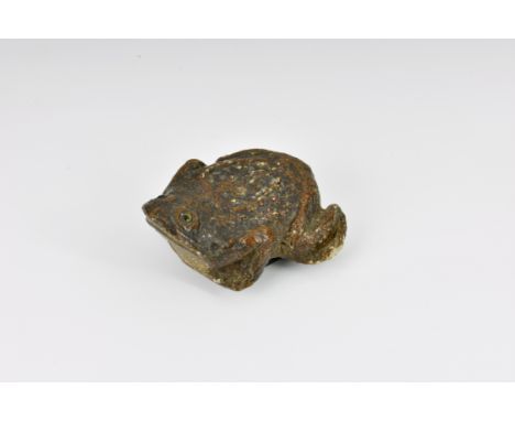 A late 19th century novelty papier mache figural 'Toad' snuff box, the realistic toad with glass eyes, measuring 3 3/8in. (8.