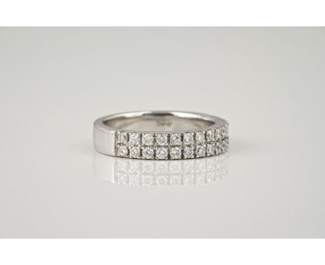 An 18ct white gold and diamond two row eternity ring, with two rows of fifteen brilliant cut diamonds, total 0.64ct, ring siz