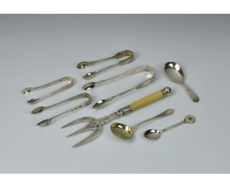 A Victorian pierced silver bread fork, Josiah Williams &amp; Co., London 1892; together with four pairs of sugar tongs, one w