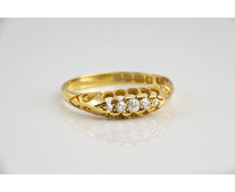 An Edwardian 18ct yellow gold and diamond five stone ring, the graduated old cut stones totalling 0.16cts, hallmarked Birming