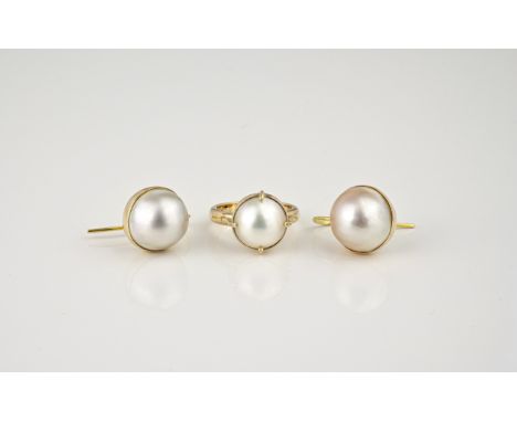 A pair of 9ct gold Mabé pearl earrings, 12mm. pearls, on hook fittings; together with a 9ct gold Mabé pearl ring, size K. (3)