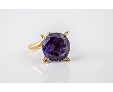 A vintage 14ct rose gold and faux-Alexandrite ring, the round cut 12.5mm. faux-Alexandrite in an open four claw setting, ring