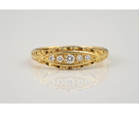 A 9ct yellow gold and diamond gypsy set ring, with five graduated brilliant cut diamonds, in a pierced marquise setting, ring