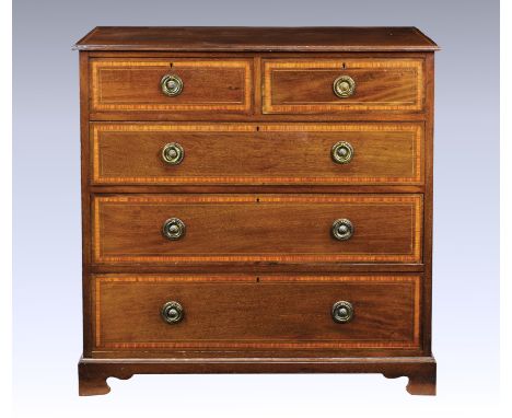 An Edwardian mahogany crossbanded satinwood and boxwood and ebony inlaid chest of drawers, with two short and three long draw