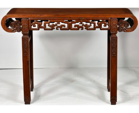 A Chinese hongmu altar table, mid-20th century, the rectangular top with downturned, scroll ends, over a carved and pierced f