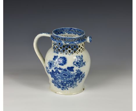 An early 19th century pearlware blue and white puzzle jug, baluster form, decorated with Chinese style peonies and other flow