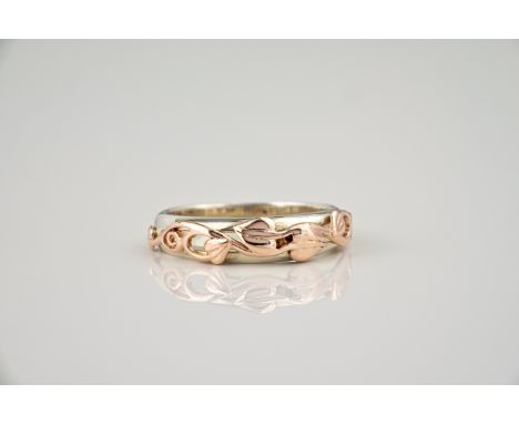 A Welsh 9ct rose gold and silver ring by Clogau, the openwork setting with interlaced heart shaped leaf decoration, ring size