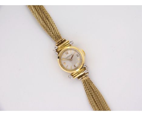 A 1960s ladies Jaeger LeCoultre yellow gold and diamond cocktail watch, the circular, silvered 7mm. dial signed 'Jaeger LeCou