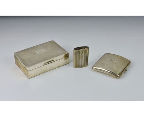 A silver cigarette box, Birmingham, 1963/64, makers mark indistinct, the hinged cover with engine-turned decoration, later in