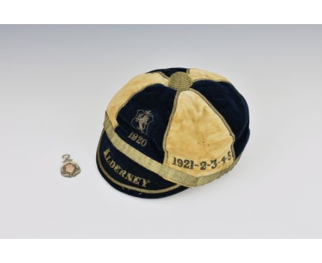 An extremely rare 1920 'ALDERNEY' Muratti cap and Peace Cup medal - Channel Islands football interest, the blue and white cap