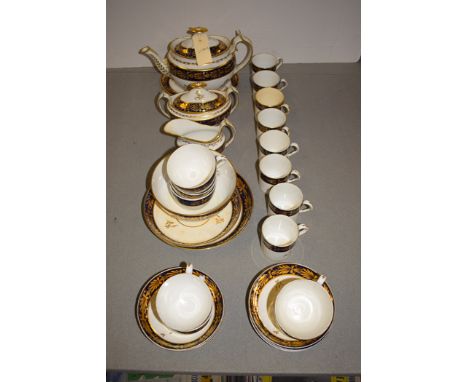 A Regency Spode style tea service, white ground, blue border and gilt decoration, no. 192.