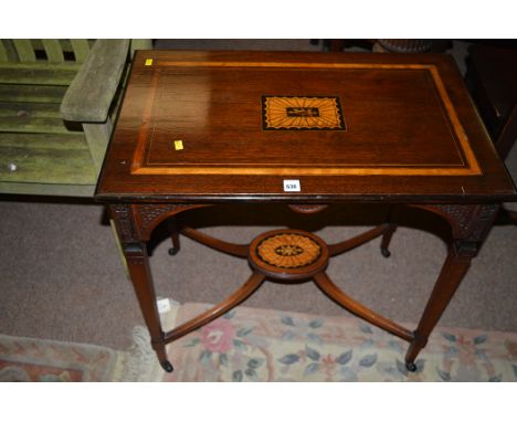 A reproduction inlaid mahogany rectangular occasional table, blind fretwork decoration to frieze, the square tapering legs jo