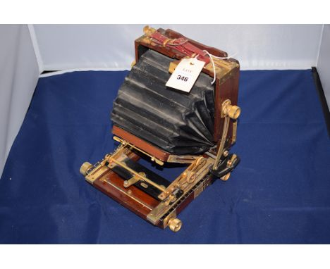 A brass mounted mahogany plate camera.
