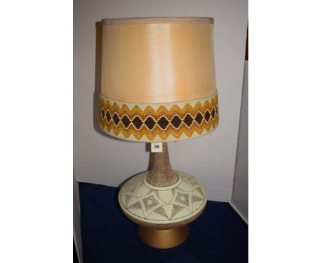A modern Studio Pottery table lamp, with woolwork and silk shade.