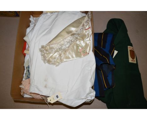 A Northumberland County hockey blazer dating from 1927/28; a school scarf; embroidered silk tablecloth; bed linen; and other 