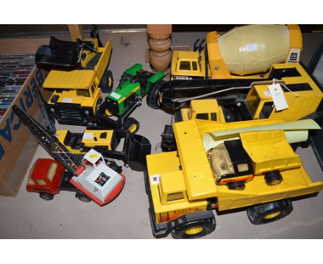 Tonka trucks, to include: Turbo Diesel; Mighty Diesel; another by Matchbox; a tractor; and others.  (9)