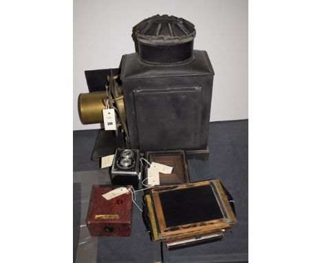 A black painted magic lantern case (no lens); various camera plates; part of a box camera; a Monarch camera; and a Pixie Flex