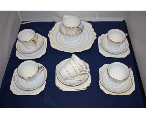 An Art Deco 'Belle China' tea for six, comprising: tea cups, saucers, tea plates, cream jug, sugar and a sandwich plate, no. 
