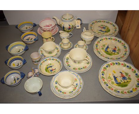 A part dinner and tea service by Longchamp, France, decorated with figures and flowers; two-handled dishes by R.W. Quimper, F