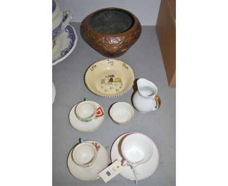 A Shelley nursery tea cup and saucer, design by Mabel Lucie Attwell; two crested cup and saucers; and a sugar bowl; a Ducal w