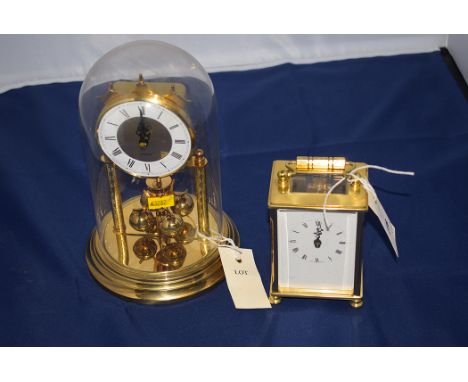 A modern brass carriage clock by Dominion, open escapement; and a perpetual movement brass mantel clock.  (2)