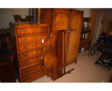 A c.1940 walnut bedroom suite by Four Shield Furniture, comprising: wardrobe, 122cm wide; a chest of seven graduating drawers