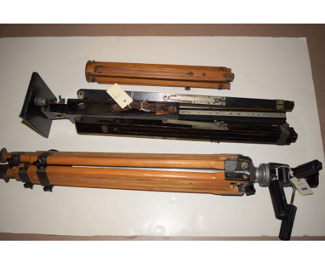 Three early 20th Century camera tripods.