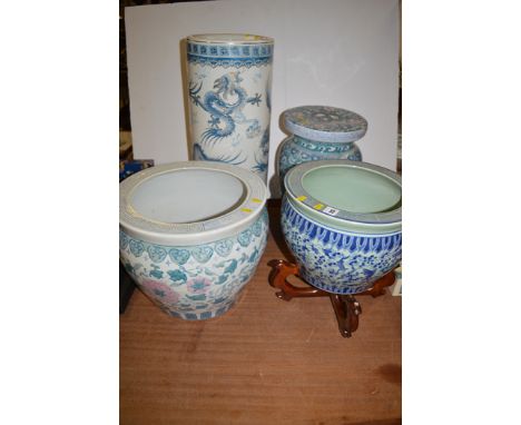 Modern Chinese ceramics, to include: a stool; stick stand; and two jardinieres, one decorated with fish, one on stand.