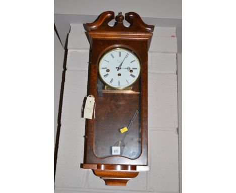 An 18th Century style wall clock by Comitti, London, enamel roman dial, in walnut case.
