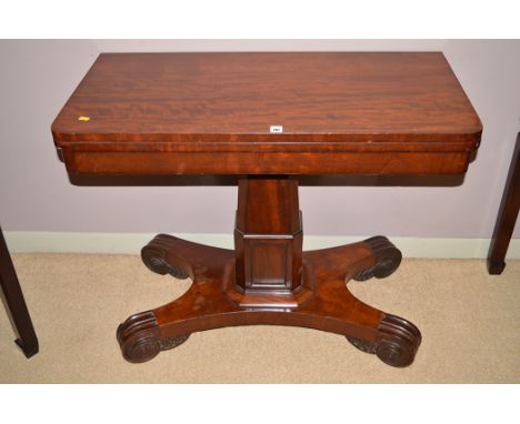 A Regency mahogany turnover swivel top card table, raised on canted rectangular support and scrolling feet, 91.5 x 46 x 73.7c