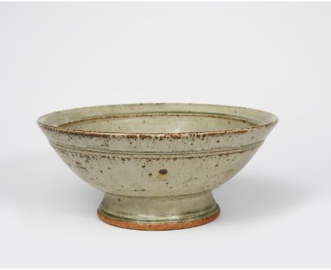 Richard Batterham (1936-2021) a stoneware footed bowl with chattering band, covered to the foot in an ash glaze with iron spo