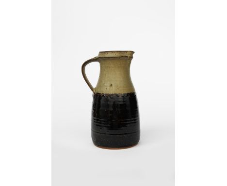 Richard Batterham (1936-2021) a tall stoneware jug, ash glaze above band of black iron unsigned, remains of paper label 35.5c