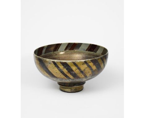Sutton Taylor (born 1943) large footed bowl, lustre decorated with bands of chevron motif in ruby and golden lustre, impresse