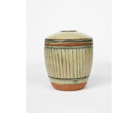 Richard Batterham (1936-2021) a large fluted stoneware caddy and cover, covered with an ash glaze, unsigned 29.5cm. high (2) 