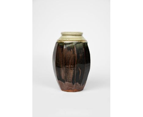 Richard Batterham (1936-2021) a cut-sided stoneware lily vase,  glazed ash to the shoulder and rim, the body a band of black 