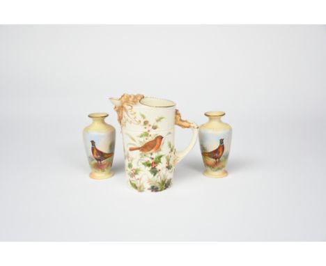 A Royal Worcester jug, cylindrical form the spout with cast as  a  lion head, the cylindrical body printed with a robin perch