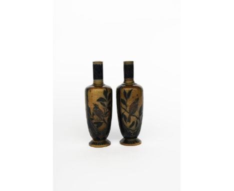 A pair of Martin Brothers stoneware vases by Robert Wallace Martin, dated 1879, slender bottle form, incised with panels of b