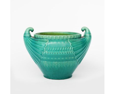 A Watcombe Pottery jardiniere designed by Dr Christopher Dresser, with pulled twin-handles, cast in low relief with bands of 