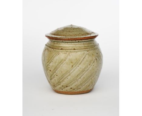 Richard Batterham  (1936-2021) a stoneware beaten jar and cover, with incised line decoration, covered in an ash glaze unsign