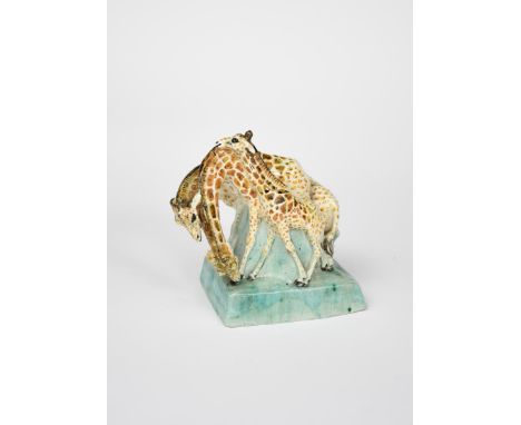 Stella Crofts (1898-1964) Erect Giraffe a stoneware figure group, glazed in colours incised Stella R Crofts 17.5cm. high Prov
